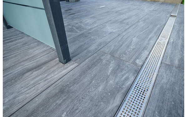 Drainage channel embedded in the terrace tiles